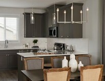 Kitchen and dinette in the Aurora showhome by Alquinn Homes in Woodbend, Leduc.
