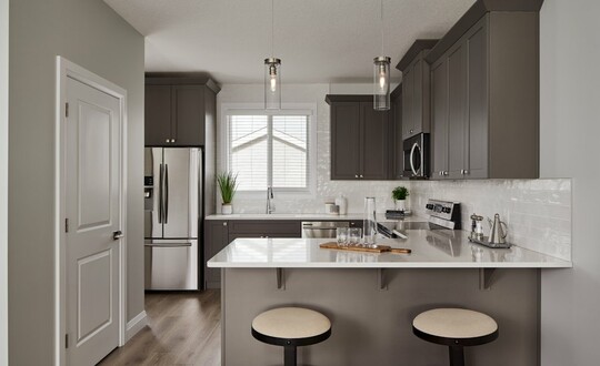 Kitchen in the Aurora showhome by Alquinn Homes in Woodbend, Leduc.